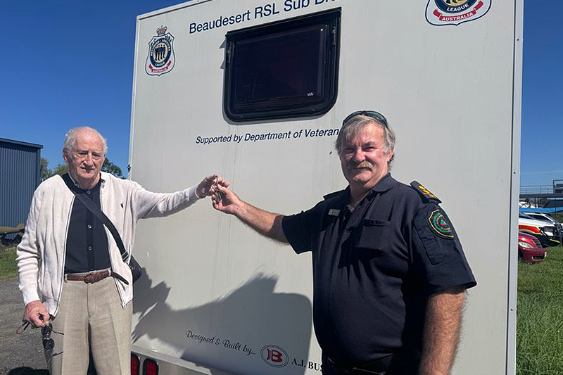  Bob Maher handing over the keys to a mobile education and community engagement trailer (donated by the Beaudesert RSL Sub Branch) to local fire brigade member Terry Watkins