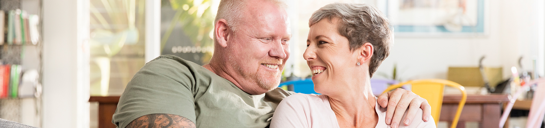 Veteran and wife smiling at each other