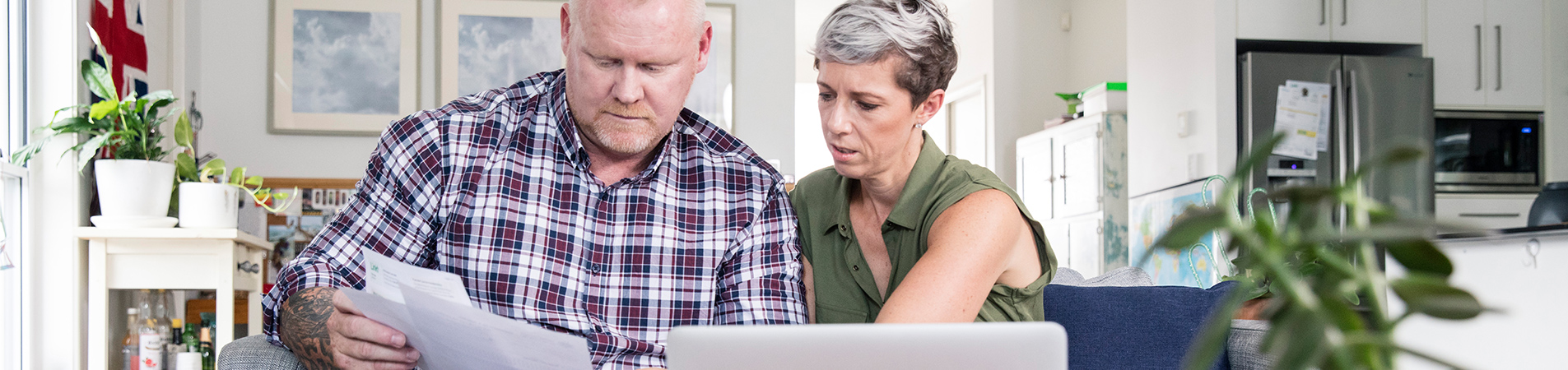 Veteran and spouse looking at important documents