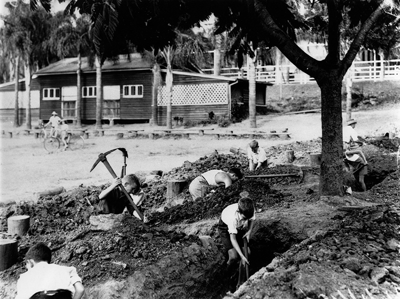 Children digging trenches at Ascot State School during WWII