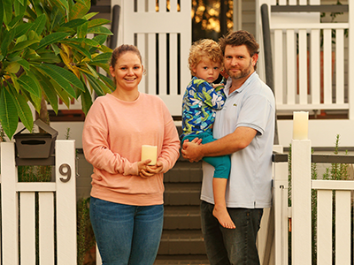 Family commemorating in front of house ANZAC Day