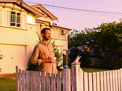 Man standing in driveway commemorating ANZAC Day with coffee