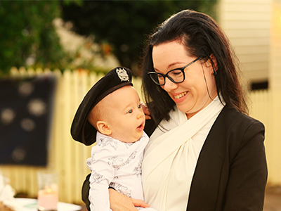 Mother and daughter commemorating ANZAC Day on driveway