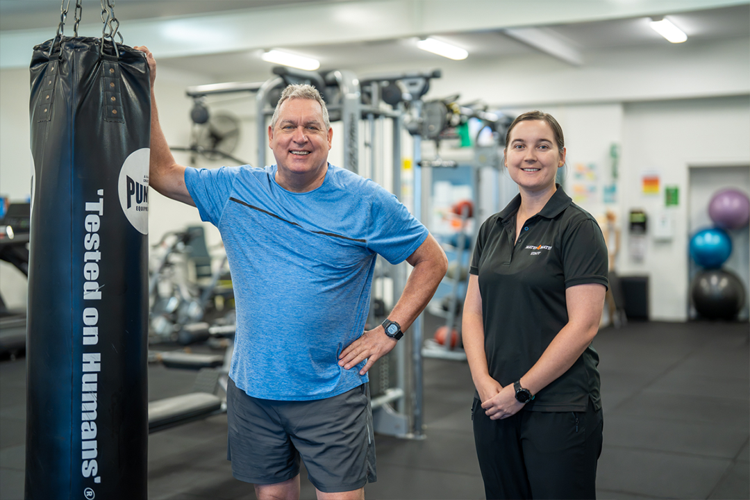 Cathy and Grant standing inside the VFWC Townsville rehabilitation gym