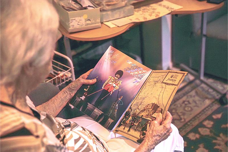 Elsie Dalzell holding booklet