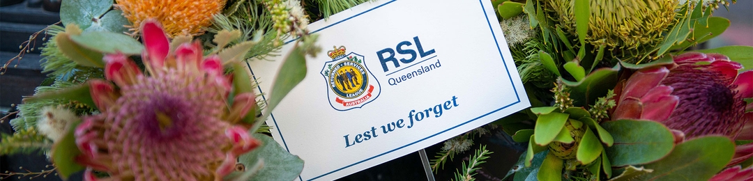 Lets we forget card sitting within a wreath