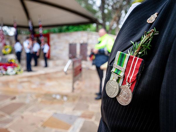War medals with rosemary pinned to a suit jacket