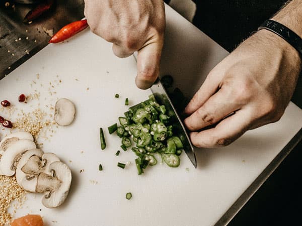 Chopping board with mushroom and jalapeno